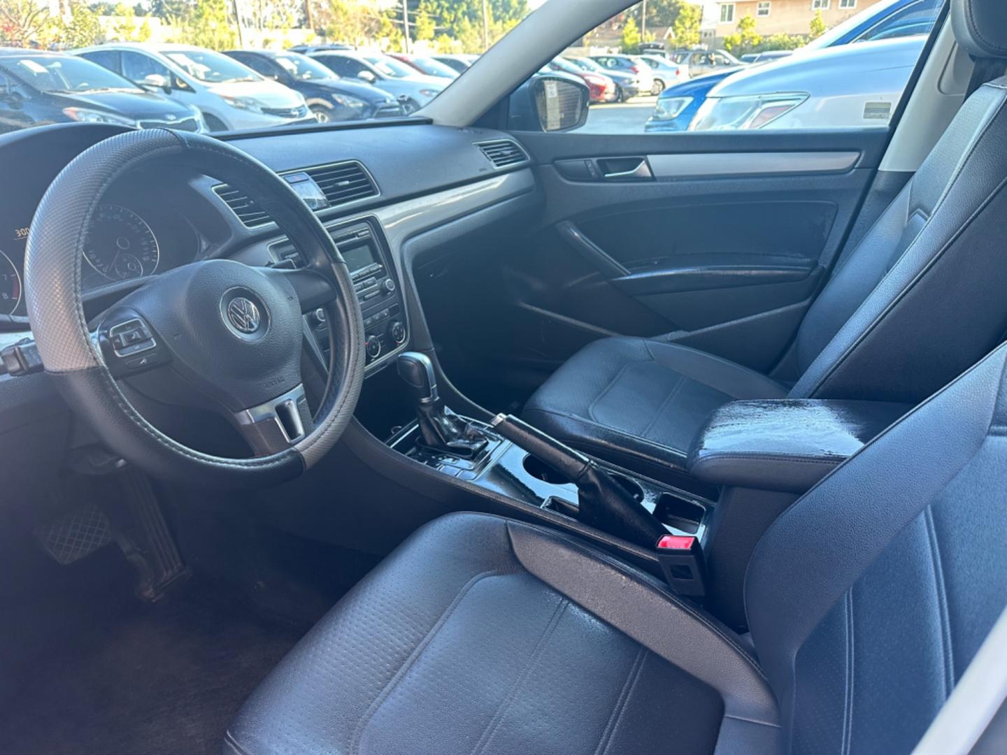 2015 Gray /Black Volkswagen Passat leather (1VWAT7A39FC) with an 4 CYLINDER engine, Automatic transmission, located at 30 S. Berkeley Avenue, Pasadena, CA, 91107, (626) 248-7567, 34.145447, -118.109398 - iscover Refined German Engineering: 2015 VW Passat Wolfsburg Edition - Now at Our Pasadena, CA Dealership Embrace the perfect blend of luxury and performance with the 2015 VW Passat Wolfsburg Edition, available at our BHPH dealership in Pasadena, CA. This exquisite model symbolizes Volkswagen's c - Photo#1